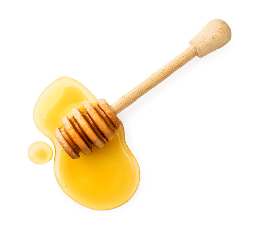 closeup of honey wand and honey